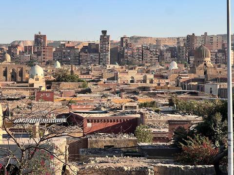 Skyline view over a densely built city with historic architecture.
