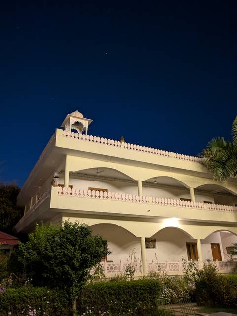 Illuminated building with traditional architecture at night.