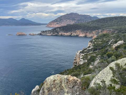 Sweeping coastal view with cliffs and ocean.