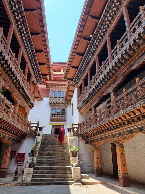       Beautifully decorated courtyard in a traditional Bhutanese dzong.
  
