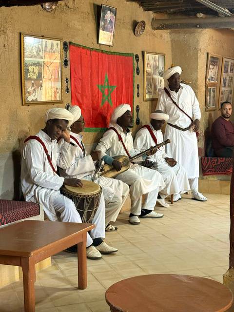 Musicians performing in traditional attire.