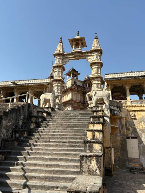 Intricate stone temple entrance with elephant statues.