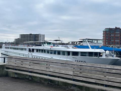 Docked cruise ship named 'France' at a harbor.