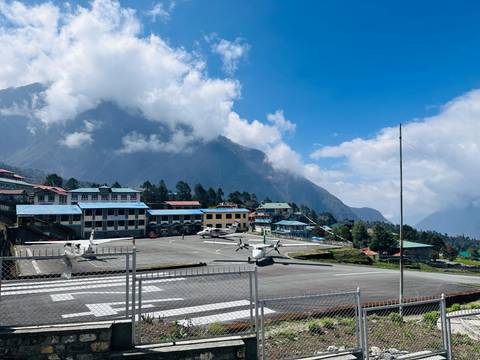 Scenic view of Lukla airport with mountains in the background.