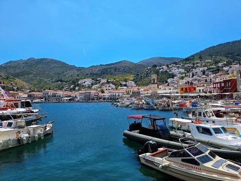       Boats docked at a picturesque coastal town.
  