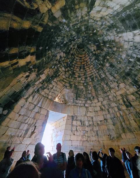       Interior dome structure with concentric stone rings.
  
