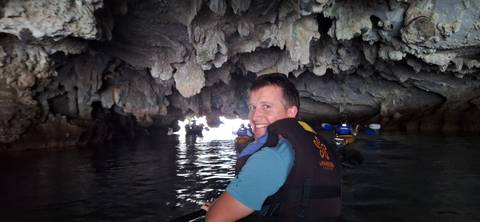 Person inside a cave system on a boat tour