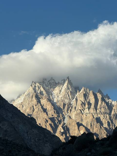 Mountain peaks partly covered in clouds.