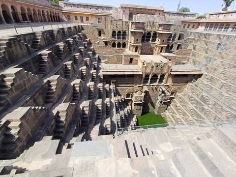       Ancient stepwell with intricate carvings.
  