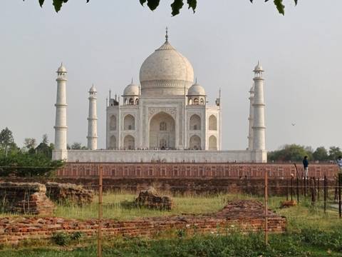 The iconic Taj Mahal with gardens in front.
