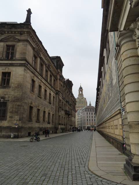 A scenic urban street with historic architecture.
