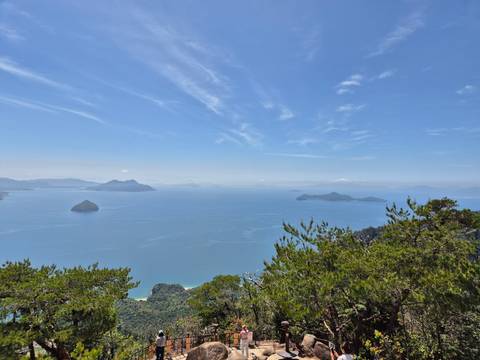       Panoramic view of blue sea and small islands.
  