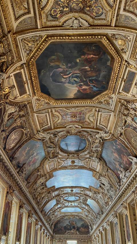 Lavish interior ceiling with intricate paintings.