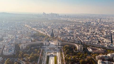       Aerial view of a cityscape with a distant skyline.
  