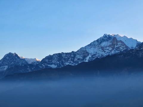       Mountain range with snow-covered peaks.
  