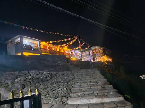 Building adorned with colorful lights at night.