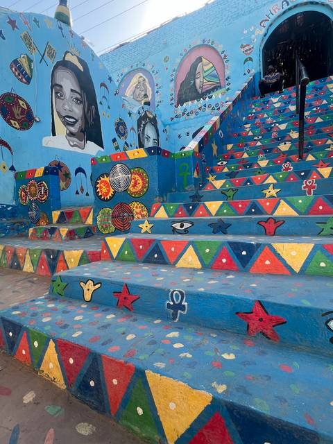       Colorfully painted steps with Egyptian motifs.
  