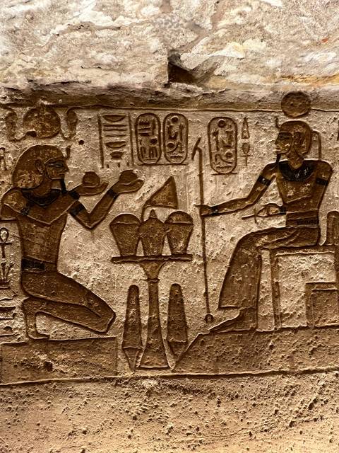       Ancient Egyptian relief with two figures.
  