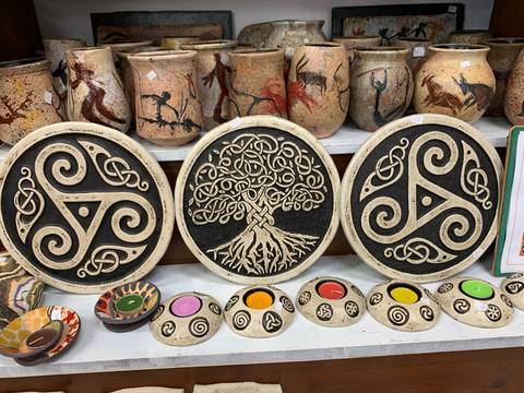       Decorative plates and items on display.
  