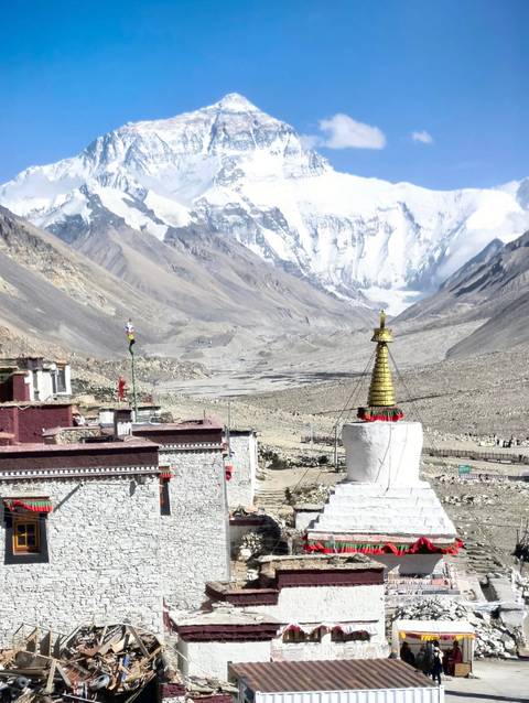 Tibetan mountain landscape with religious structures.