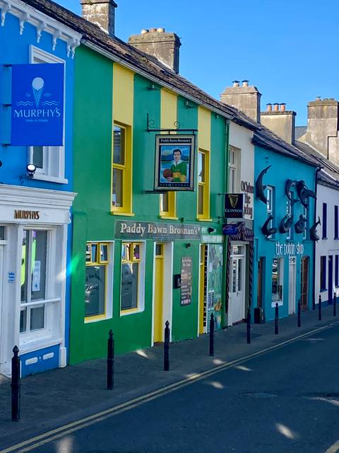       Colorful buildings in a small town street.
  
