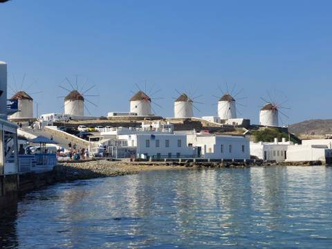       Windmills by the sea in a sunny day
  