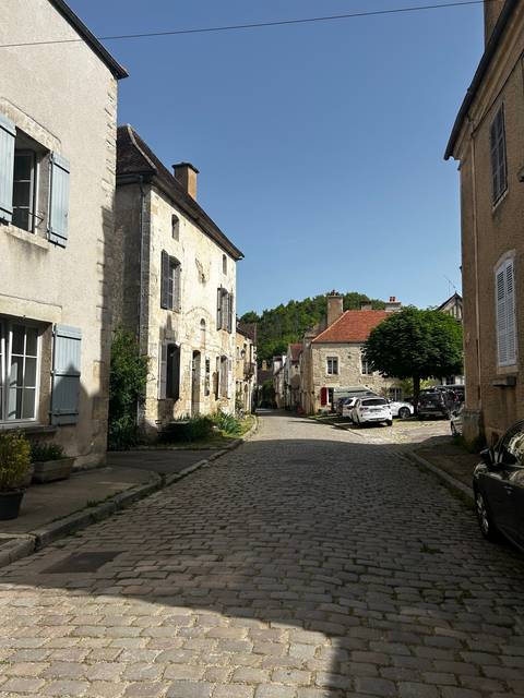Quiet cobblestone street with historic buildings