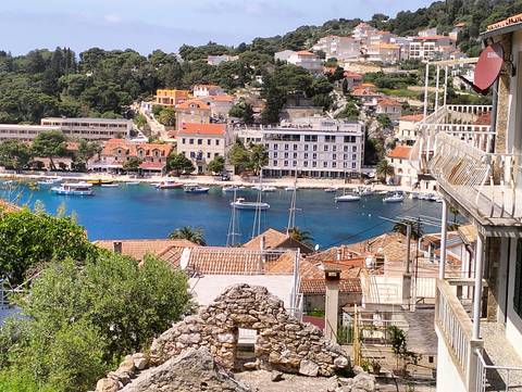       Scenic view of a coastal village with boats
  