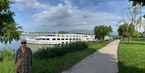 River cruise ship docked by the riverbank