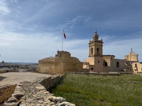 Historic building with a flag on a clear day