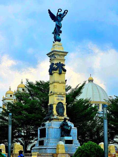 Monument in front of a historical building.