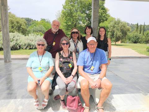 Group of tourists posing during a tour in Greece.