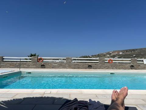 Infinity pool overlooking the ocean and hills.