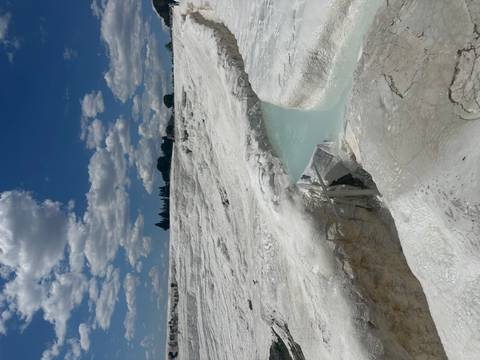       White travertine terraces with a turquoise pool
  