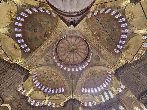       Intricate domes and ceiling of a historic mosque.
  