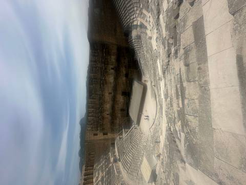       Ancient amphitheater with a partially enclosed area.
  