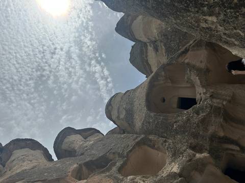       Rock formations with small cave openings.
  