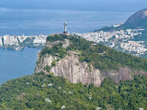       Aerial view of Christ the Redeemer statue overlooking the city and coastline.
  