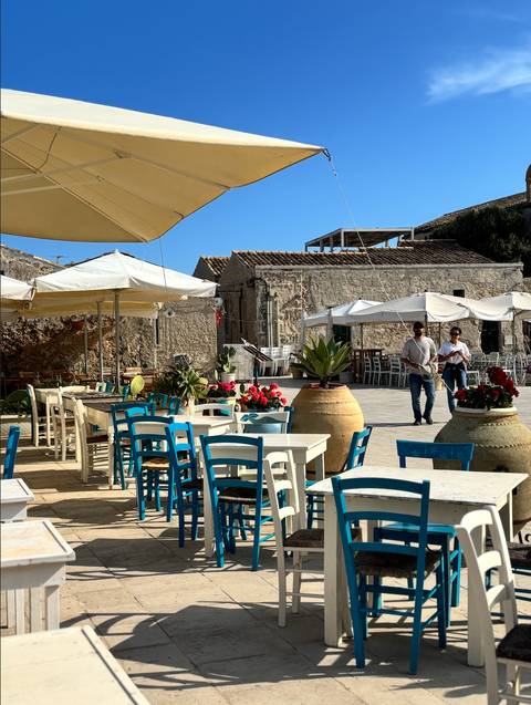 Outdoor restaurant setting with traditional decor.