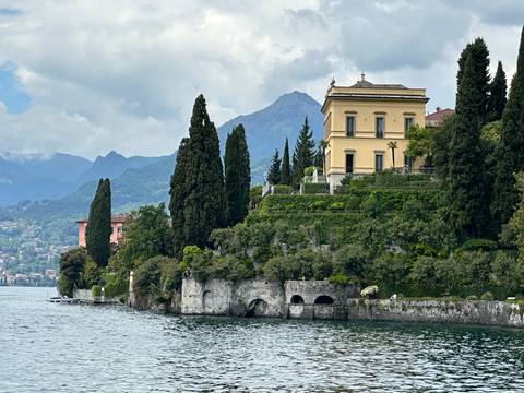 Luxurious lakeside villa with well-maintained gardens.