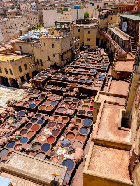       Traditional tannery with colorful dye pits.
  