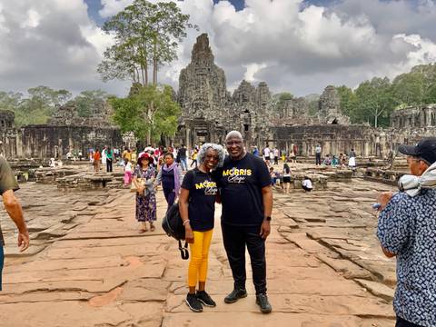       A woman emerging from a narrow tunnel.
  