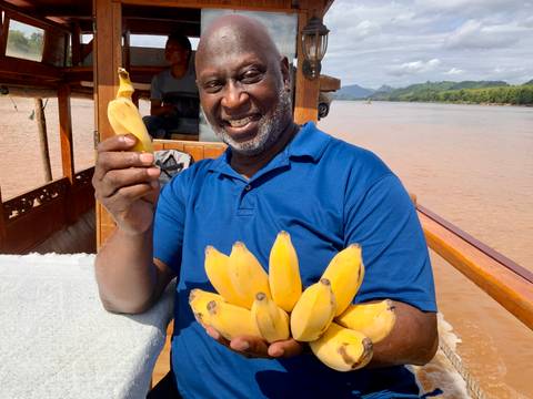       Person posing with traditional dancers.
  