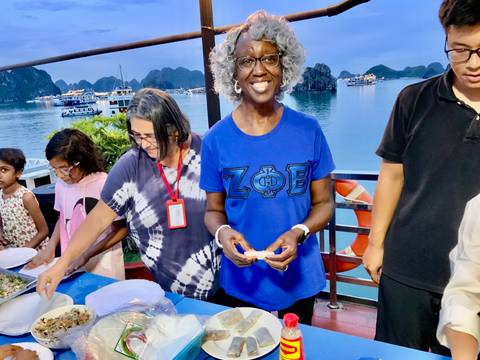 Couple sitting at a café with vibrant mural art.
