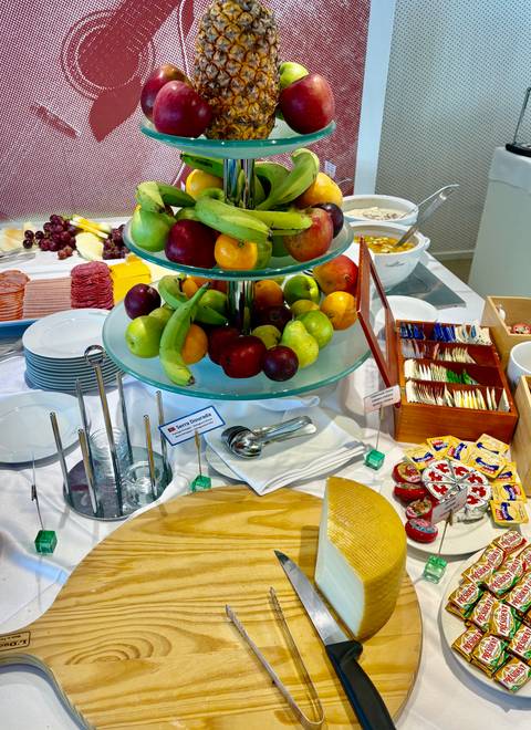 Fruit and food display on a buffet table.