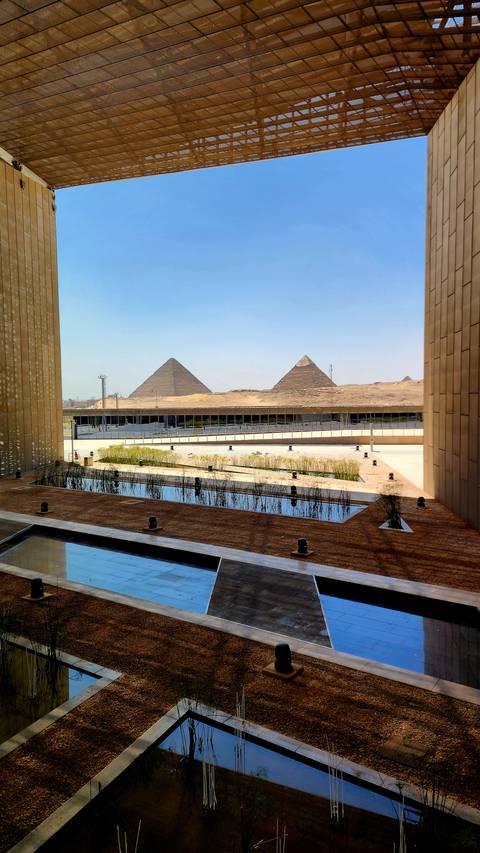 View of the pyramids from a modern building.