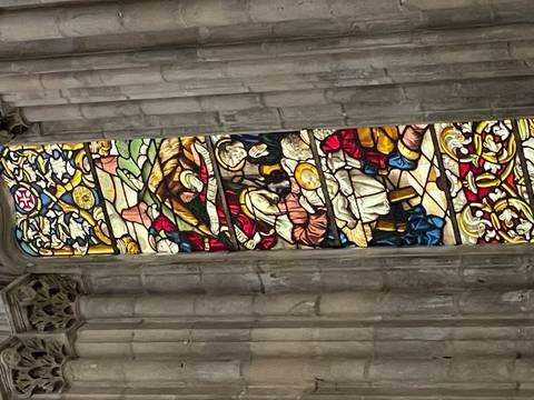       Stained glass window with colorful design.
  