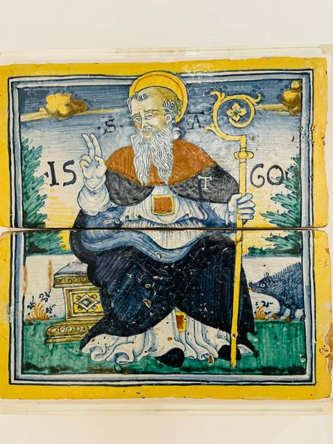 Artistic tile with a depiction of a religious figure.