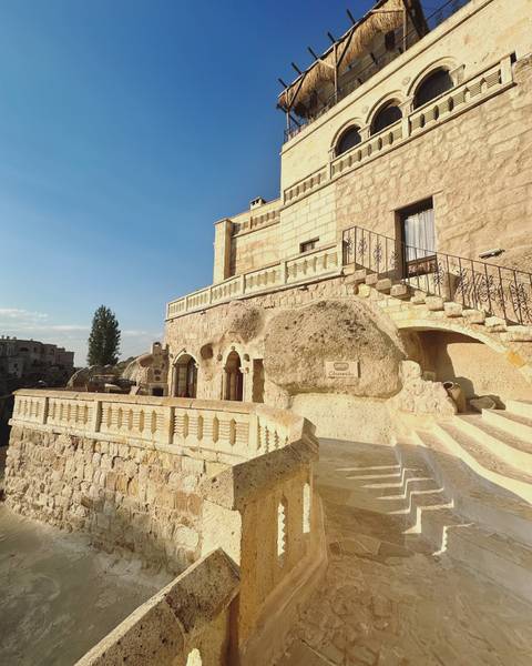 Stone architecture under a clear sky.