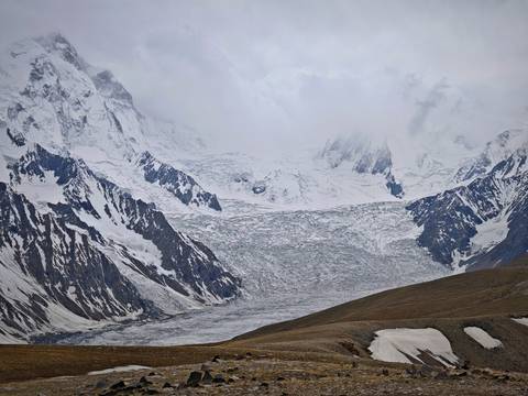 Majestic snowy mountain peaks and a glacier.